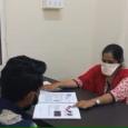 Woman showing a diagram to a patient